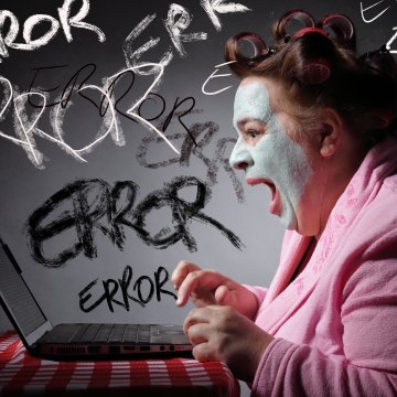 registry cleaners software benefits frustrated woman with face mask on yelling at laptop error written on walls